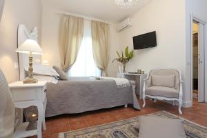 En eller flere senge i et værelse på Casa Ponte Sisto Guesthouse