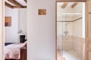 a bathroom with a shower with a glass door at Le Logis de Cléré in Cléré-les-Pins +43 photos
