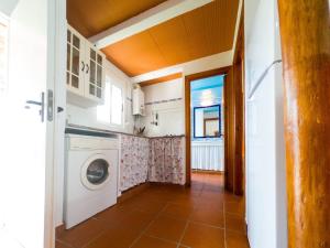 a laundry room with a washer and dryer at Casas Pepe 6 Bungalow in Los Caños de Meca