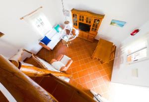 an overhead view of a kitchen with orange tile at Casas Pepe 6 Bungalow in Los Caños de Meca