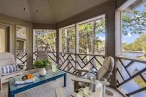 a screened in porch with a table and chairs at 4826 Green Dolphin Way in Kiawah Island