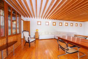 a living room with a table and a couch at Villa Cala Bona in Cala Bona +31 photos