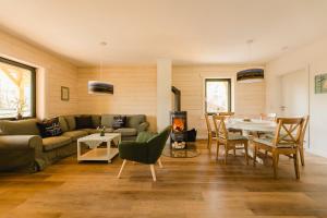 a living room with a couch and a table at Blockhaus 2 in Eslohe