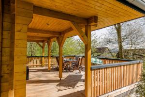 a wooden pavilion on the deck of a house at Blockhaus 2 in Eslohe