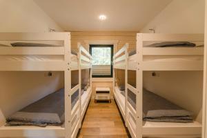 a room with four bunk beds in a tiny house at Blockhaus 2 in Eslohe