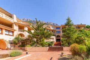an apartment building with a staircase in a courtyard at Simplicity luxury apartment in Altea