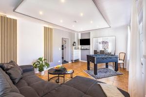 a living room with a couch and a table at Premium Basislager in Albstadt