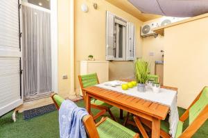 a dining room with a table and chairs at NURAS - Casa IAIA Alghero city center in Alghero