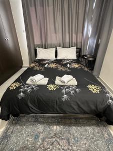 a bedroom with a bed with two towels on it at Serene Getaway Near Protaras in Paralimni
