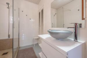 a bathroom with a bowl sink and a shower at Can Joi 12 in Sóller