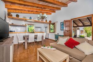 a living room with a couch and a table at Villa Moreno in Pollença