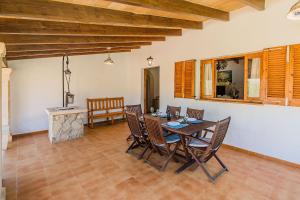 a dining room with a table and chairs at Villa Moreno in Pollença