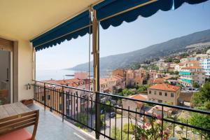 a balcony with a view of a city at Margherita in Ospedaletti