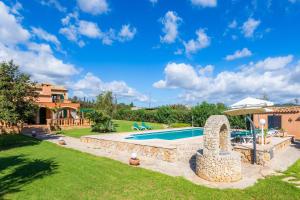 an image of a villa with a swimming pool at Es Fasser in Son Servera