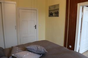 a bedroom with a bed with two pillows on it at Ferienwohnung Harz Idylle 2 in Güntersberge