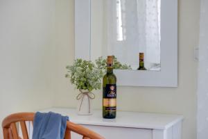 a bottle of wine sitting on top of a table at S9 room in Nikiana