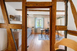 a room with a kitchen and a dining room at Ferienhaus Hildahüsli in Badenweiler +30 photos
