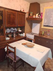 a kitchen with a table with a bowl of food on it at Maison entière Garage et parking in Montluçon