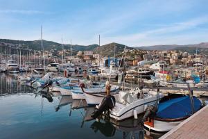 a bunch of boats are docked in a harbor at Rosa dei Venti - Centro Storico in Varazze