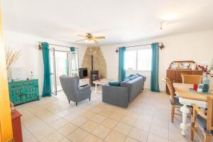 a living room with a couch and a table at Casa La Paz in Torrox