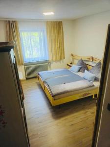 a bedroom with a large bed in a room at Bellas Mühlbachtal in Friedenfels
