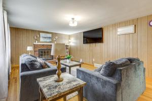 a living room with two couches and a fireplace at Walk to Shops & Eats! Attleboro Basecamp in Attleboro