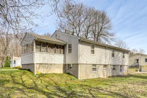 a large house on a grassy yard with at Walk to Shops & Eats! Attleboro Basecamp in Attleboro