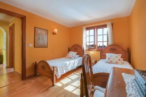 a bedroom with two beds and a window at Villa Casa Concha in Teguise +19 photos