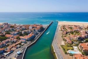 an aerial view of a town next to the ocean at Villa Rénovée, 5min Plage in Seignosse