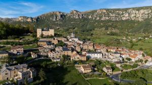 an aerial view of a village in the mountains at Gite Sublime Spa, Piscine Indoor in Mostuéjouls +19 photos