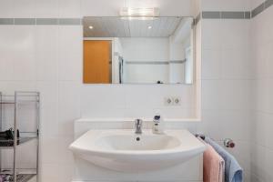 a white bathroom with a sink and a mirror at Grundhof Christian Faller in Rohr +26 photos