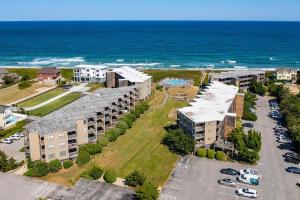 an aerial view of an apartment complex near the ocean at Delightful Diversion in Duck