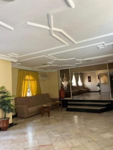 a living room with a couch and a table at Hotel Tiznit in Tiznit +24 photos