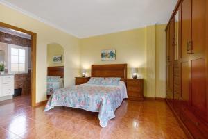 a large bedroom with a bed and a dresser at Casa Paco 3 in Costa Calma +16 photos
