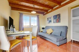a living room with a couch and a table at Casa Paco 3 in Costa Calma