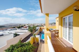 a balcony with a view of a city at Casa Paco 3 in Costa Calma