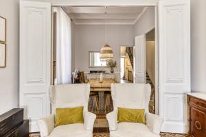 a dining room with a table and two chairs at Casa señorial 14 personas -C. Brava in Palafrugell