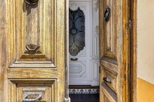 an open wooden door with a wooden paneled door sidxsenalsenalsenalsenalangering at Casa señorial 14 personas -C. Brava in Palafrugell +33 photos
