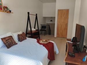 a bedroom with a bed with a bowl on top of it at Departamentos A&B in Resistencia