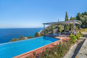 a villa with a swimming pool and a view of the ocean at Villa sea view 2 in Athani