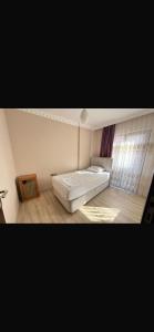 a white room with a bed and a window at Trabzon 4 storey Villa-House by the sea - Denize sıfır 4 katlı müstakil Villa - Ev in Trabzon +48 photos