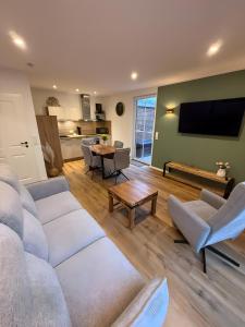 a living room with a couch and a table at Thiesa in Berumbur