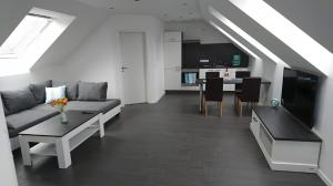 a living room with a couch and a table at Ferienwohnung Spreewald in Schlepzig