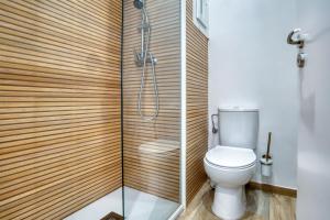 a bathroom with a toilet and a shower at Old Side Platja d Aro in Platja d'Aro