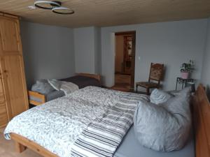 a bedroom with a large bed in a room at Veronika in Wesenberg