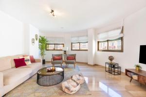 a living room with a couch and a table at Terraza Larios in Málaga