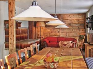 a dining room with a wooden table with fruit on it at Schwarzwaldbauernhaus Bernau in Bernau im Schwarzwald