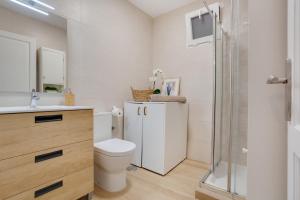 a bathroom with a toilet and a sink and a shower at Casa Jica in La Orotava +22 photos