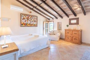 a bedroom with a bed and a living room at Can Xuri in Campos +18 photos