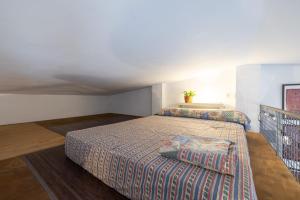 a bedroom with a large bed in a room at Estudio La Cochera in Deltebre +15 photos
